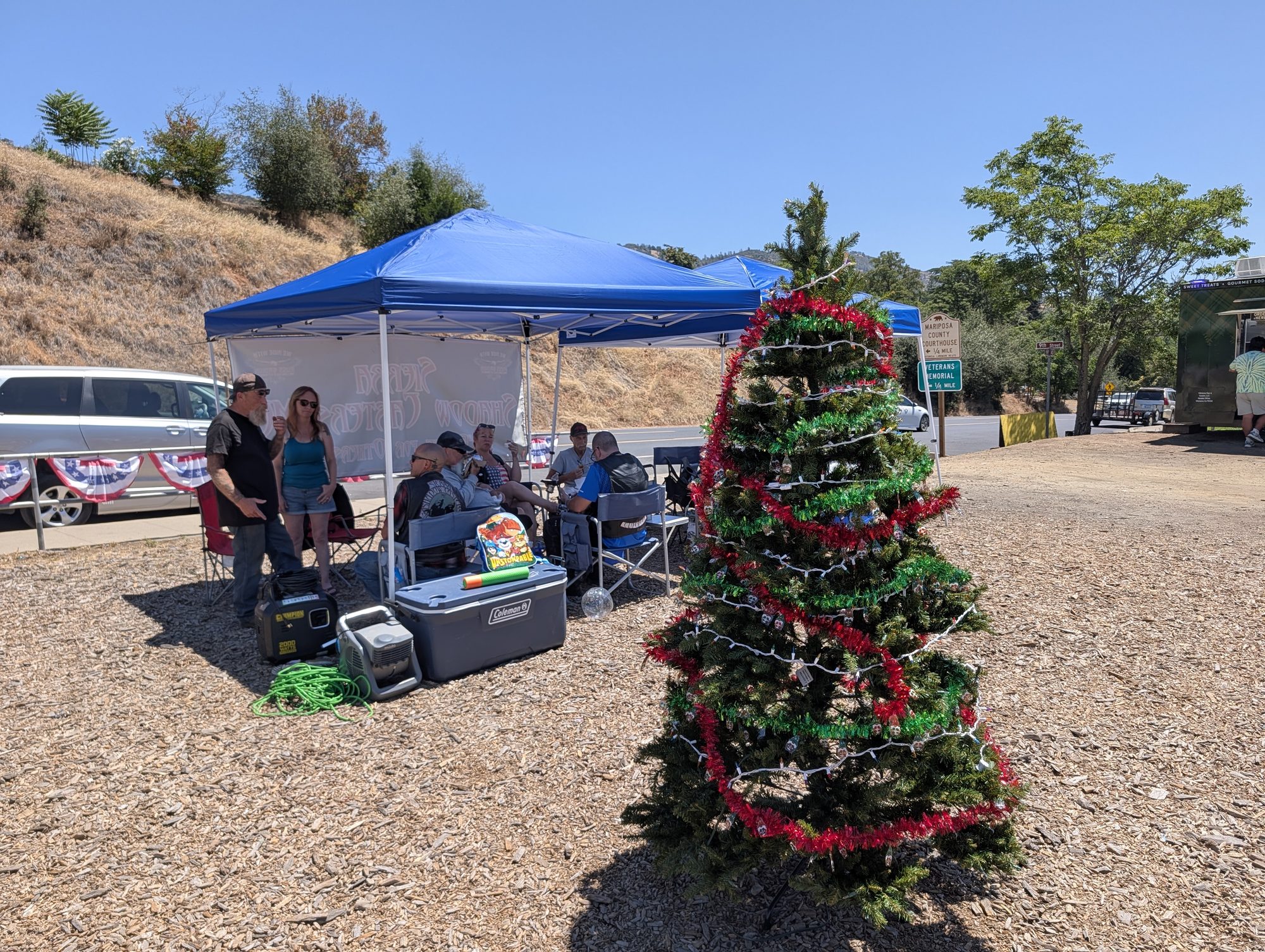 A Christmas tree in the July sun at the Frost Shop Marketplace.
